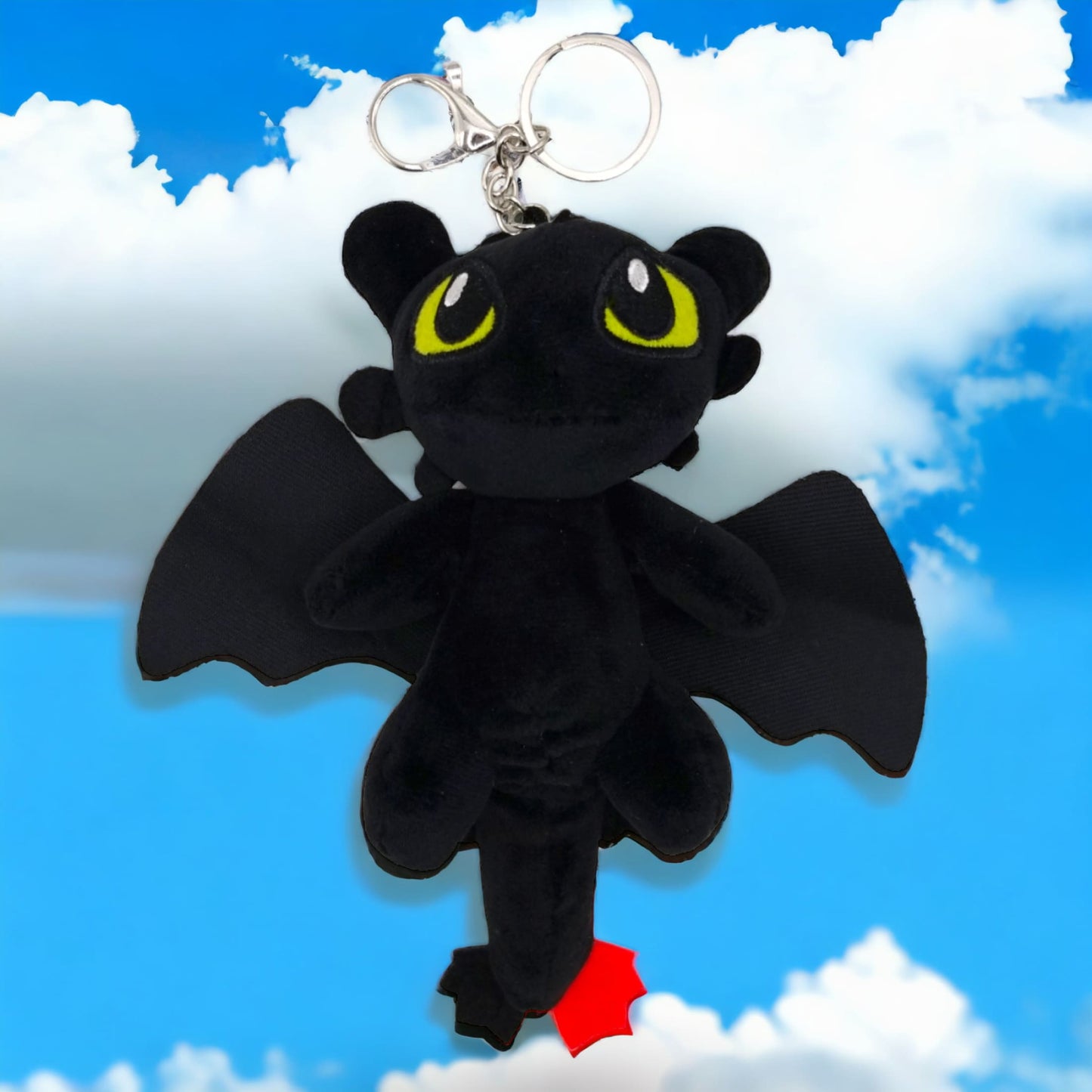 Toothless dragon plush mascot with green eyes and red tail tip keychain