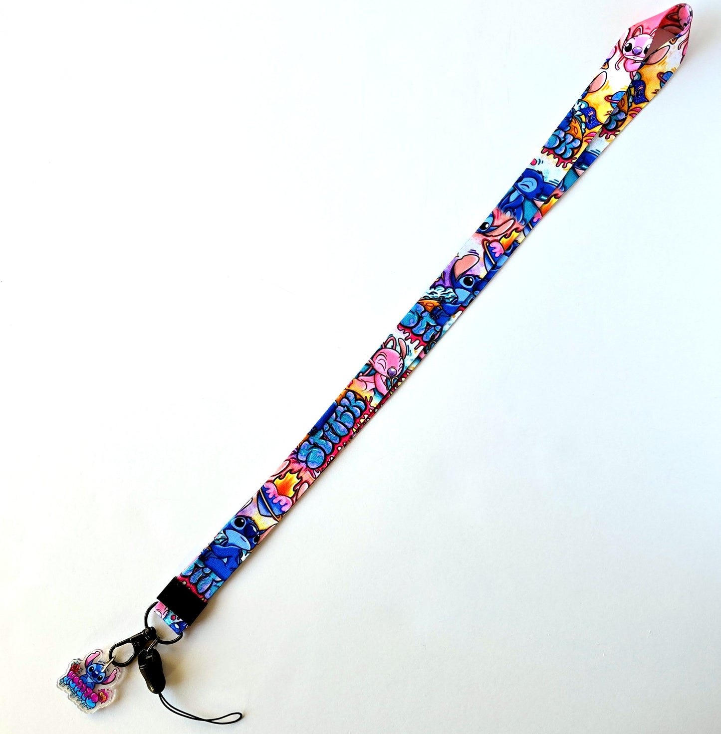 Flat lay of Stitch lanyard fully extended with charm