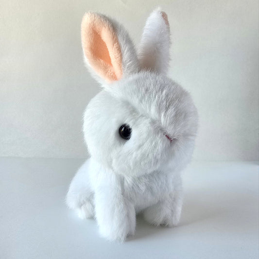 Front view of white bunny plush keychain showing soft microfleece fur, pale pink inner ears, and silver ball-chain against a white background