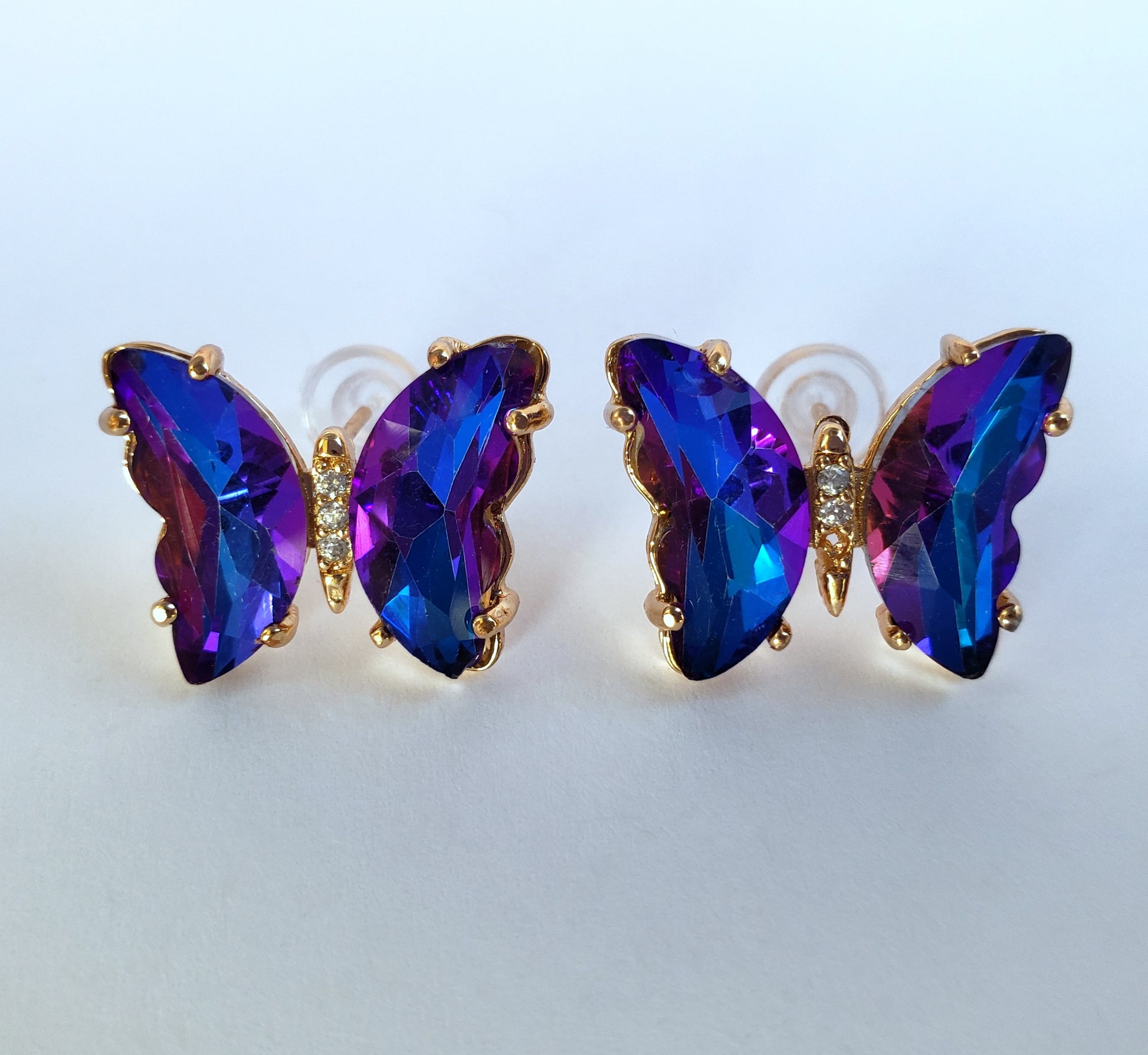 Crystal butterfly stud earrings in mystic galaxy finish on white background