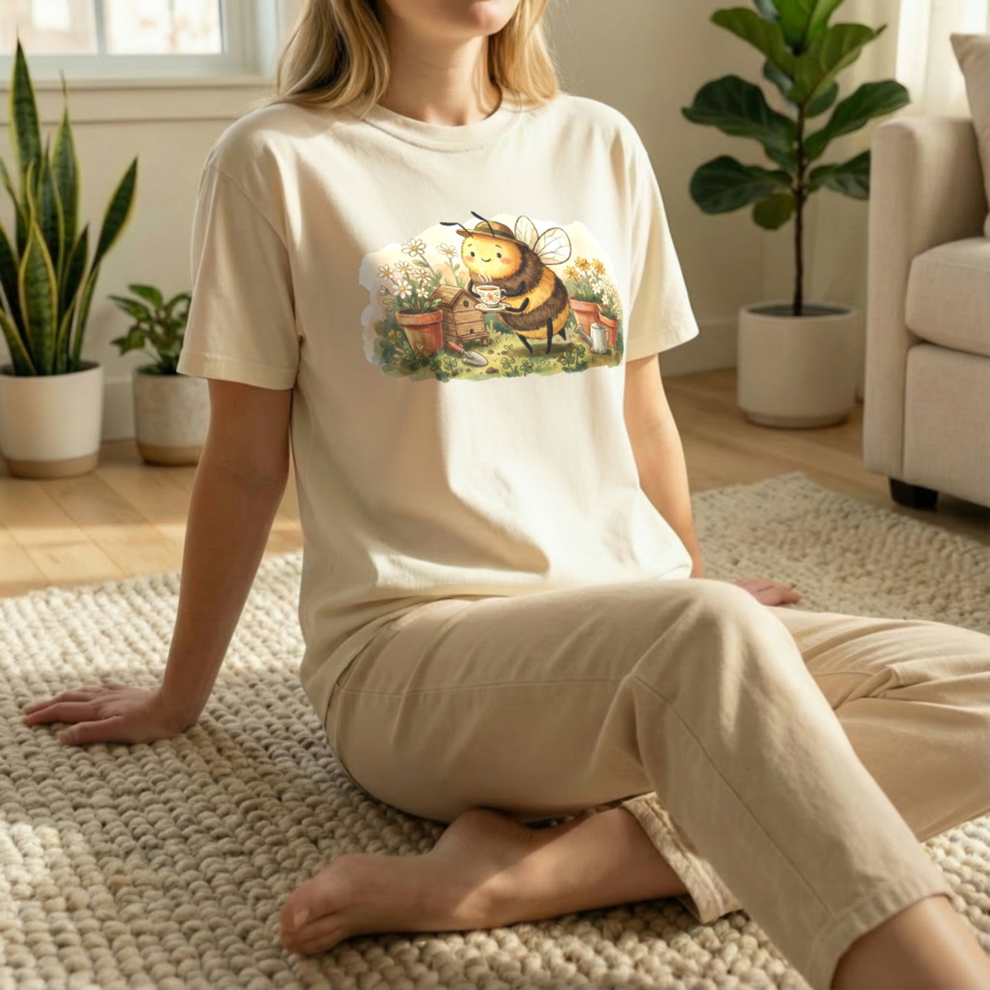 Garden Bee Tee shown in floor pose on ivory shirt