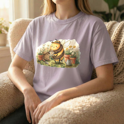 Garden Bee Tee displayed in seated lifestyle pose on orchid shirt