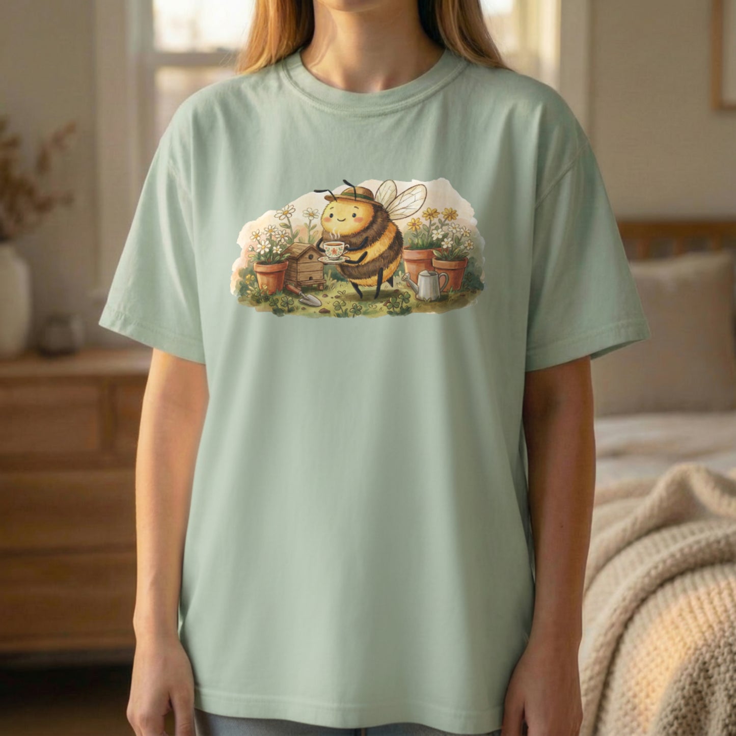 Garden Bee Tee shown in standing lifestyle pose on light green shirt