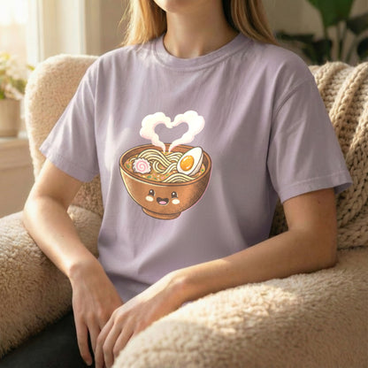 Happy Ramen Tee worn sitting on orchid Comfort Colors t-shirt