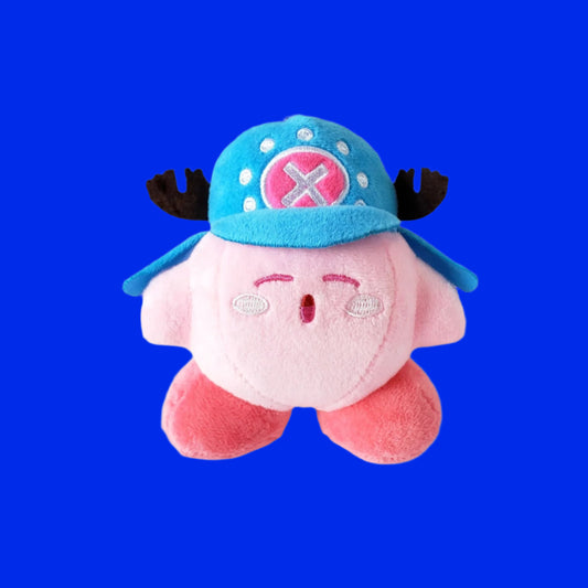 Kirby x Chopper plush keychain on bright blue background showing Kirby wearing Chopper’s signature hat