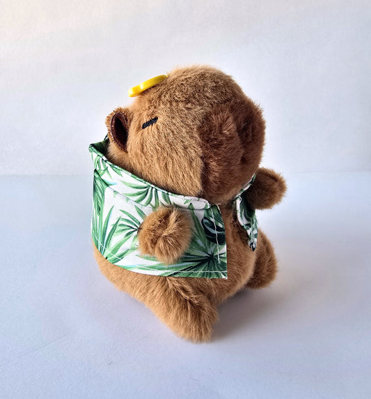lose-up of plush keychain with leaf shirt and yellow button hat