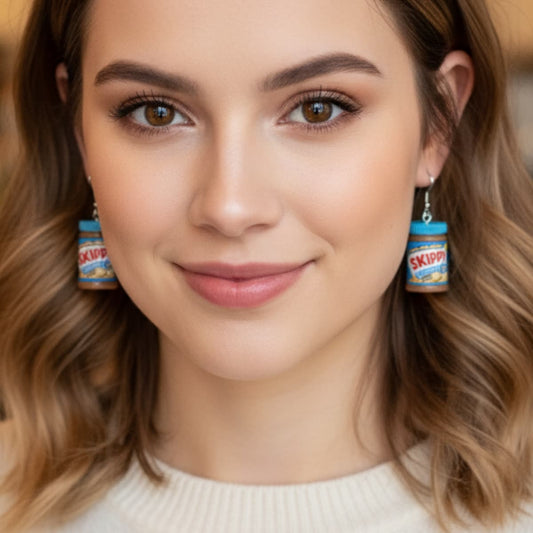 Model wearing peanut butter jar dangle earrings, cute foodie jewelry