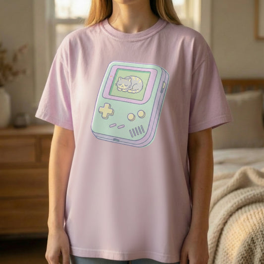 Woman wearing orchid purple Retro Gamer Cat Tee featuring nostalgic handheld console design