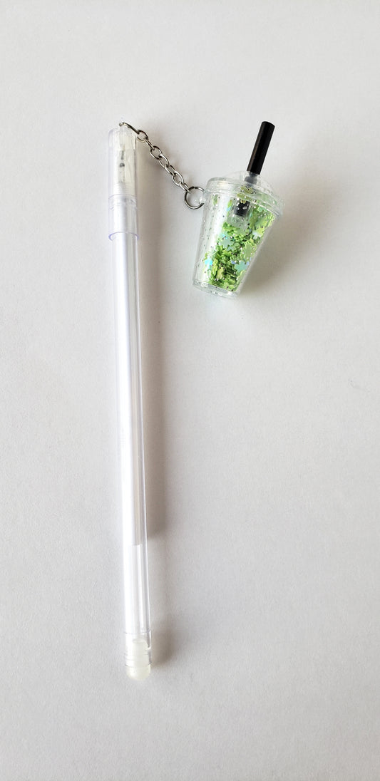 Flatlay of mint-green Smoothie Cup Shaker Gel Pen with attached smoothie cup charm on a white background