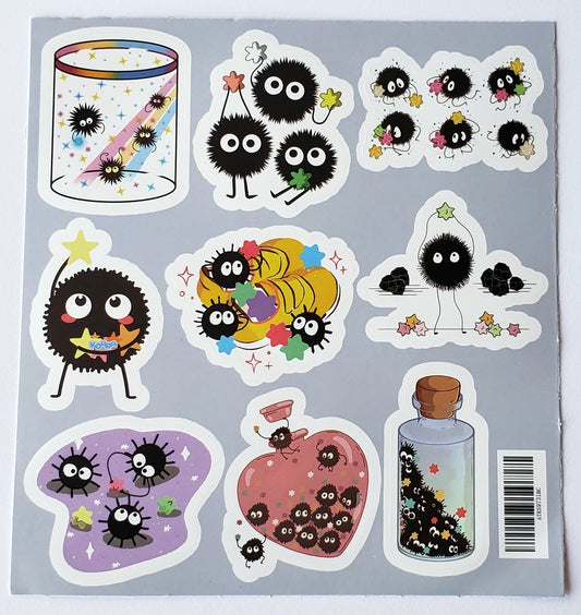 Flatlay of soot sprites inside a mason jar with star accents on a white background