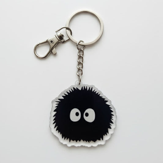 Soot Sprite acrylic keychain on white background