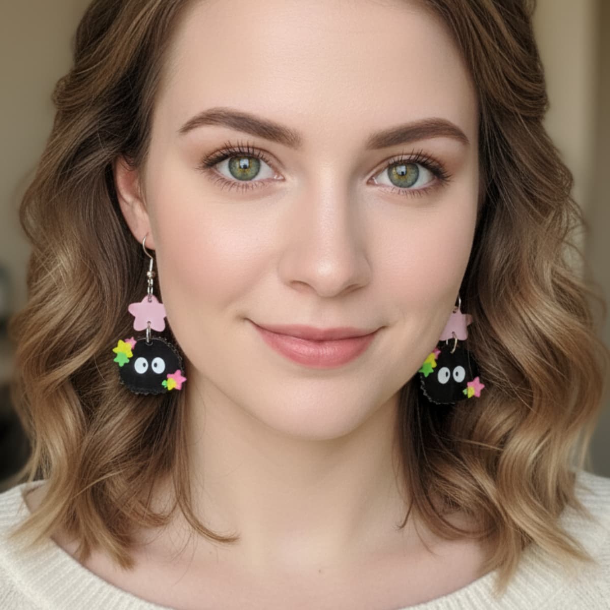 Woman wearing Starry Sprite acrylic earrings with colorful stars