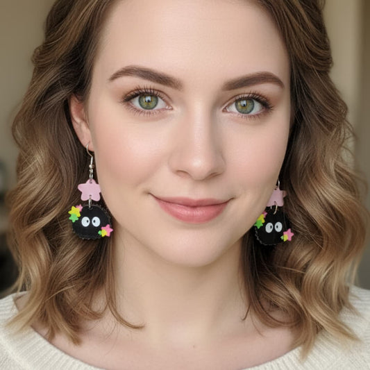Woman wearing Starry Sprite acrylic earrings with colorful stars