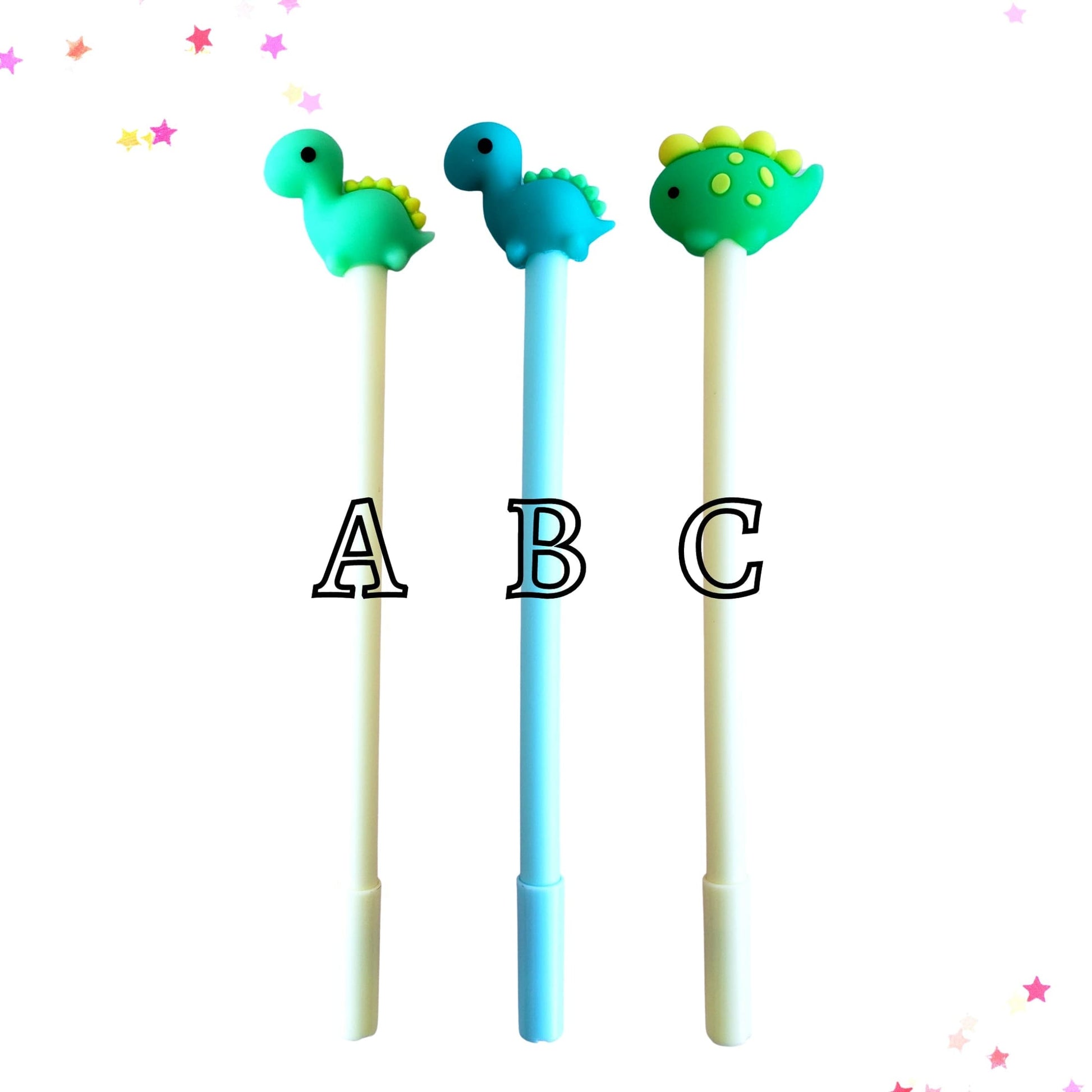 Three dinosaur pen toppers labeled A, B, C on a white background