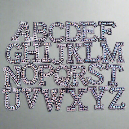 Complete set of iridescent rhinestone alphabet letter patches, perfect for customizing clothes and accessories.